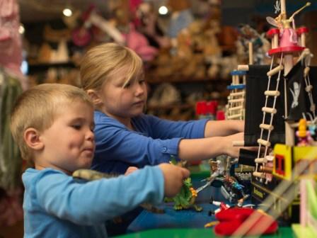 Ben and Sadie with a Pirate Ship from Le Toy Van