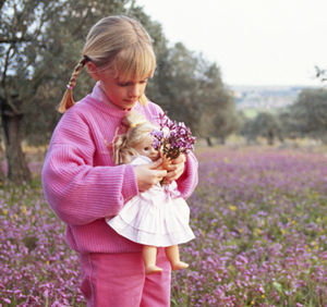 GIRL WITH DOLL AND FLOWERS